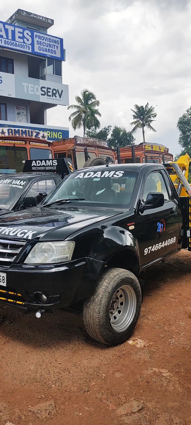 ADAMS RECOVERY photo showing a branded recovery truck